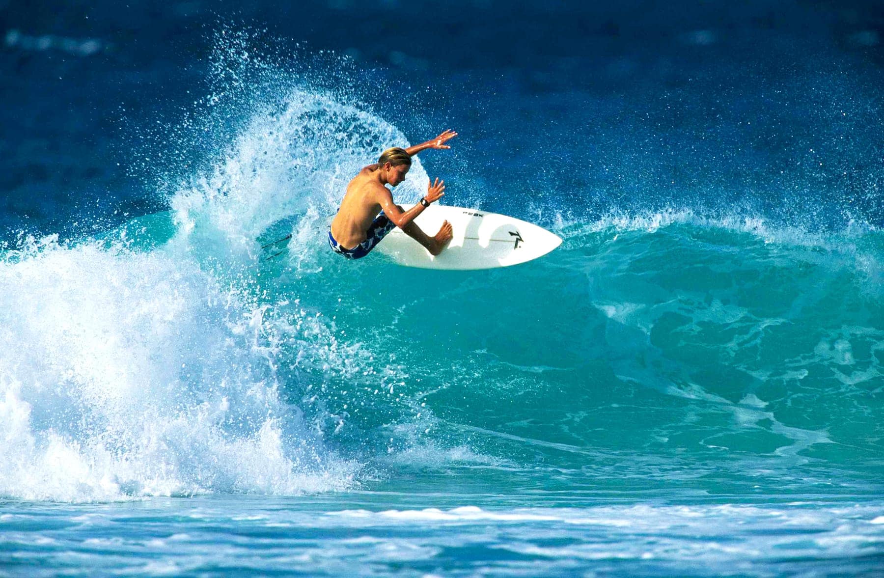 A surfer carving a wave